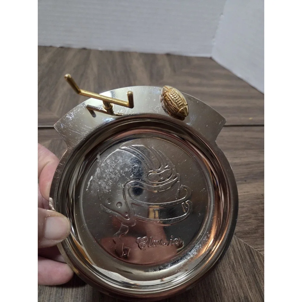 silver-tone and brass football 